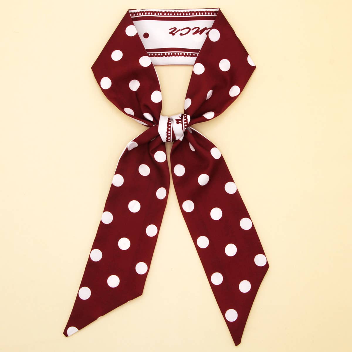 The ACCITY Floral Letter Scarf Hair Tie Ribbon is a stylish hair accessory, showcased in a chic bow on a light beige background.