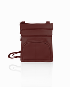 The Roma Leathers, Inc. Cowhide Leather Crossbody with phone pocket in maroon features an adjustable shoulder strap, two top zippered compartments, and a front pocket, shown against a white background.