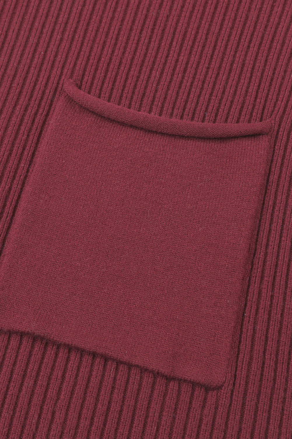 Close-up of Shewin's Patch Pocket Ribbed Knit Short Sleeve Sweater in maroon, featuring a square pocket, ideal for transitional weather.