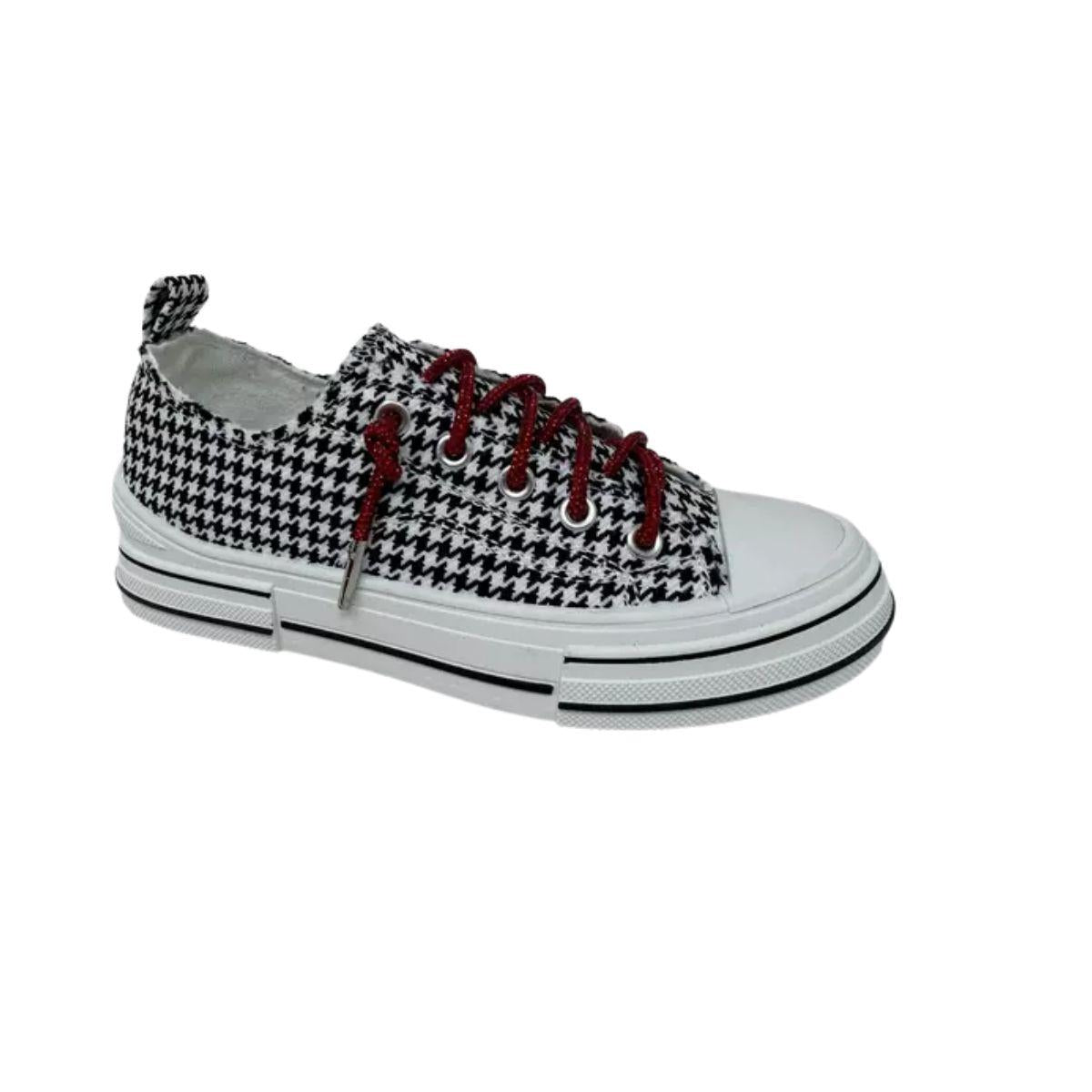 The Aman Tailor Houndstooth Sneaker by VERY G showcases a bold black and white houndstooth pattern, a crisp white sole, and eye-catching red rhinestone shoelaces, photographed on a plain white background for a standout statement look. Main image