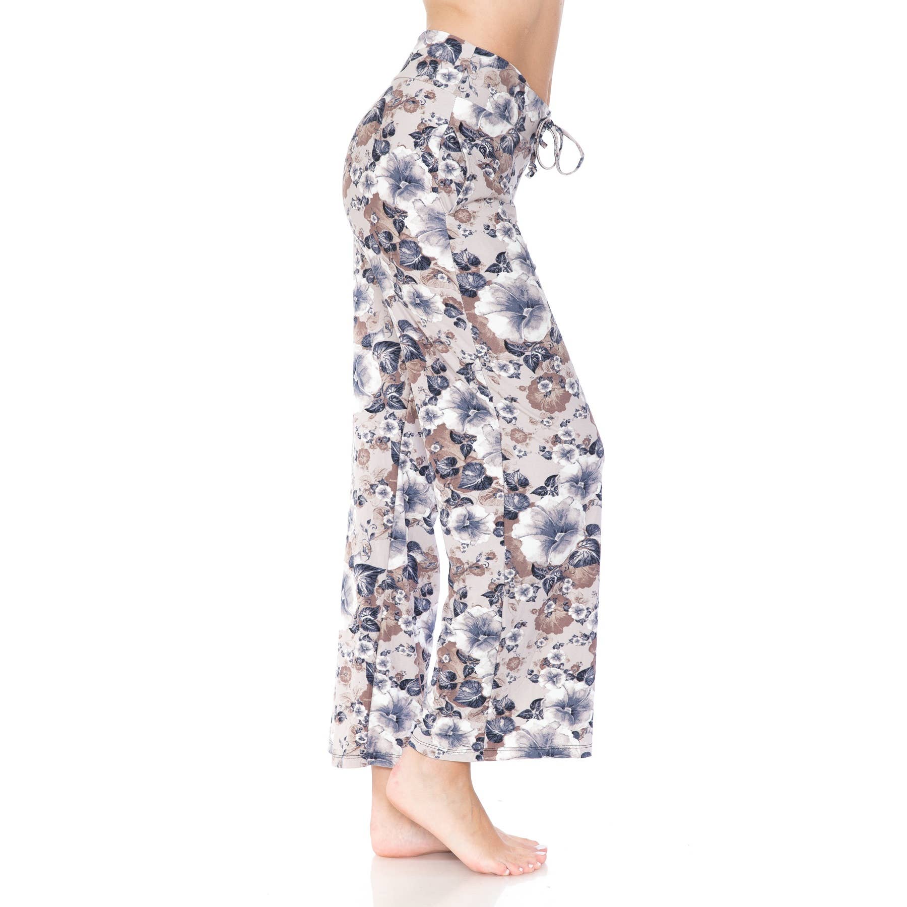 A barefoot person wears Leggings Depot Buttery Soft Print Pajama Pants featuring a high waist, wide-leg, floral print, and drawstring waist, shown in profile against a white background. Main image