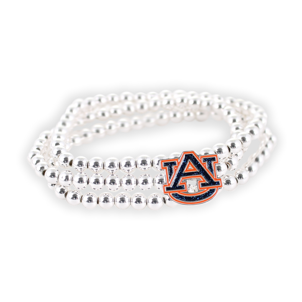 The Seasons Jewelry Auburn Glitter Enamel Logo Stretch Bracelet Set features silver beaded bracelets with a charm displaying the officially licensed Auburn University logo in glitter enamel, shown against a plain white background.