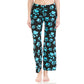 A person wears Leggings Depot’s Buttery Soft Print Pajama Pants featuring blue paw prints and an elastic waistband, standing barefoot against a white background.