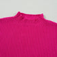 The Shewin "Patch Pocket Ribbed Knit Short Sleeve Sweater" is a bright pink, cozy knit with a high neckline. Ideal for transitional weather, it displays a ribbed texture and partially reveals a pocket.