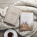 Two copies of the Devotional 10 Minutes with God for Women Faux Leather by Christian Art Gifts rest on a knitted blanket beside a cup of coffee on a wooden surface.