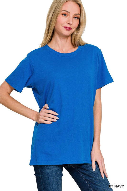 A woman poses against a white background wearing the 42POPS Short Sleeve Basic Tee in blue, paired with jeans and standing with one hand on her hip.