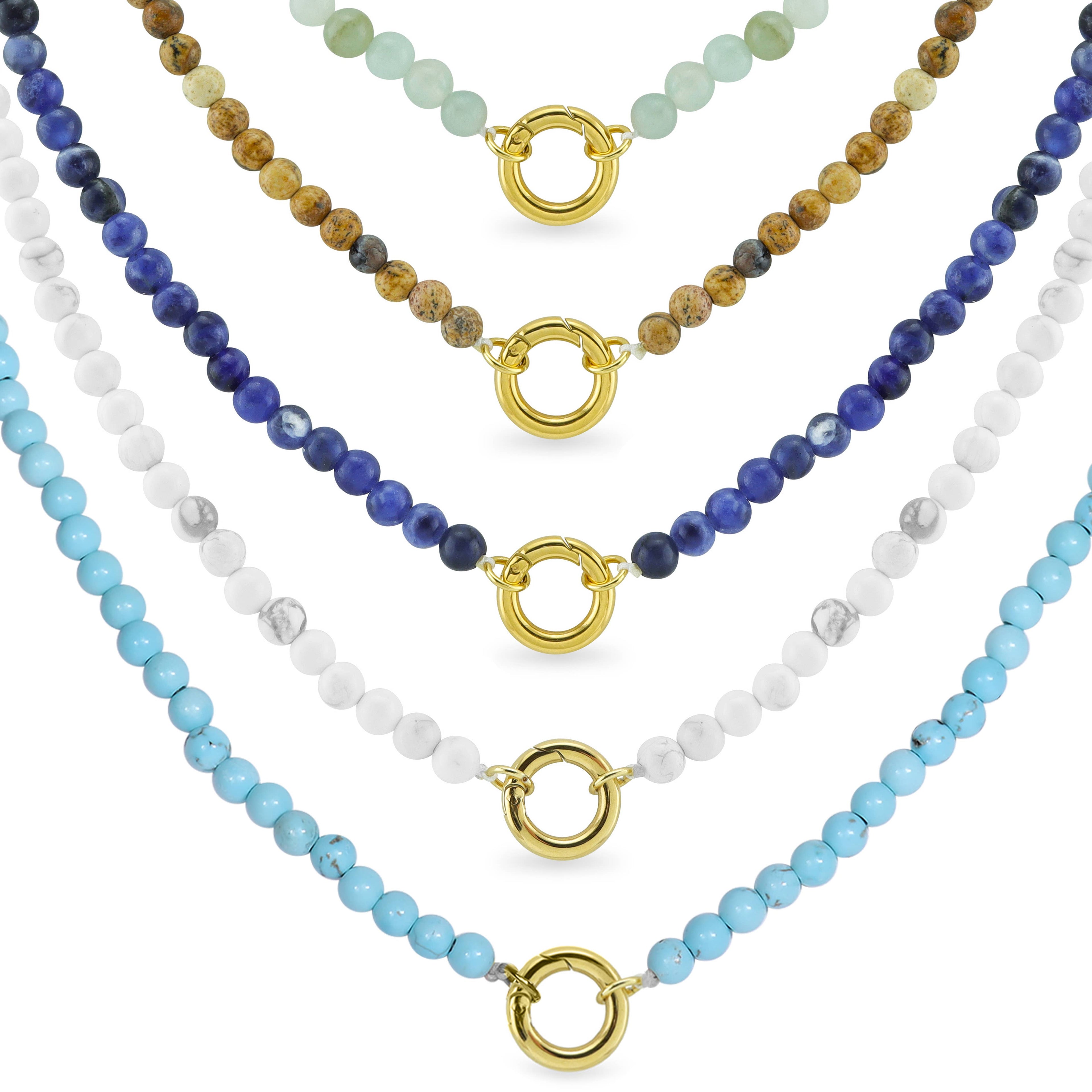 Five Semi Precious Natural Stone Charm Keeper Necklaces from WJW, each adorned with 18K Gold PVD Coated circular clasps and beads in green, brown, dark blue, white, and light blue, create a vibrant display against a white background. These necklaces seamlessly blend elegance and versatility for any occasion.