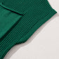 Close-up of a sleeve and pocket from the versatile Shewin Patch Pocket Ribbed Knit Short Sleeve Sweater in green, displayed on a light textured surface, ideal for transitional weather.