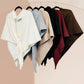 Six JC Sunny Fashion Cashmere-Blend Knit Triangle Shawls with cross-front design in white, gray, beige, taupe, burgundy, and brown hang on black hangers from a gold rack against a pale background.