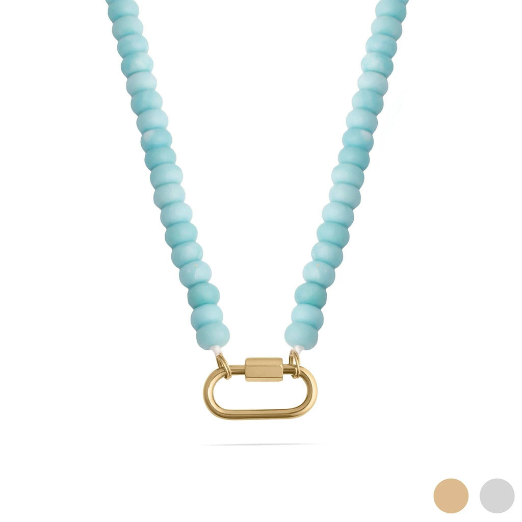 WJW Stainless Steel Turquoise Chunky Bead Carabiner Necklace featuring round light blue beads and a gold-tone carabiner clasp at the center. Two color circles, beige and gray, appear in the bottom right corner.