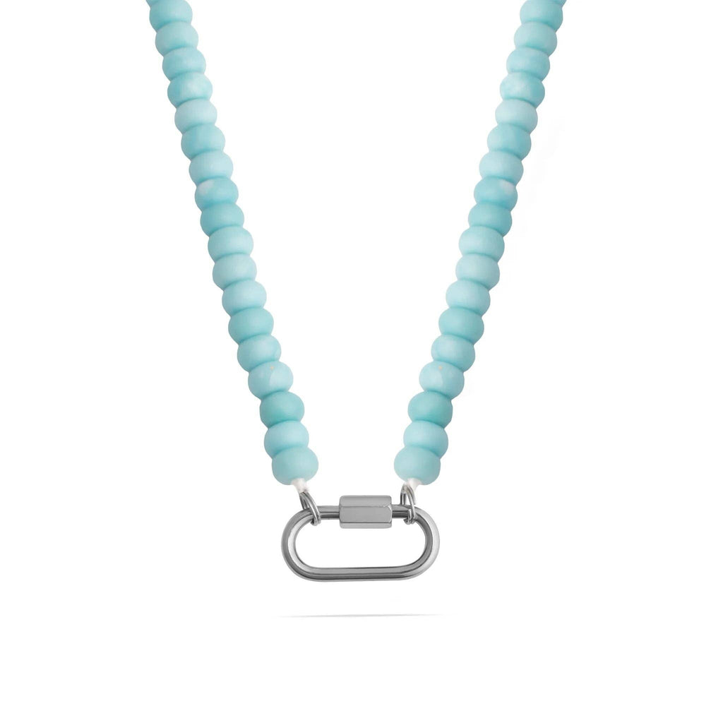 A close-up of the WJW Stainless Steel Turquoise Chunky Bead Carabiner Necklace, featuring round light blue beads and a stainless steel carabiner clasp in the center.