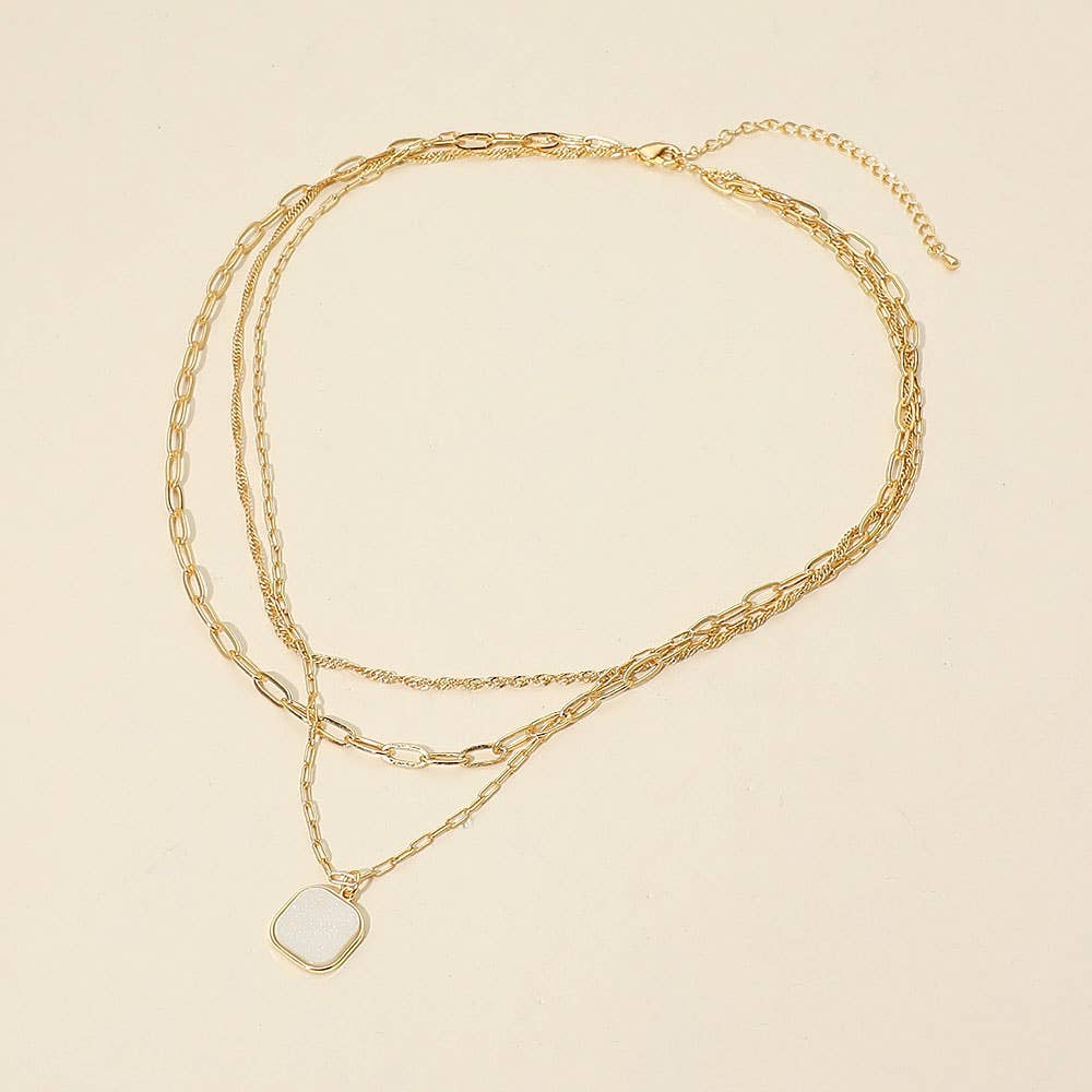 Introducing the Sensibling Corp. 18K Gold Dipped Square Pendant Accent Mixed Paperclip Chain Layered Necklace, featuring two elegant chains: one adorned with a square pendant, the other a simple, classic strand. Both are secured with an adjustable extender clasp for the perfect fit.