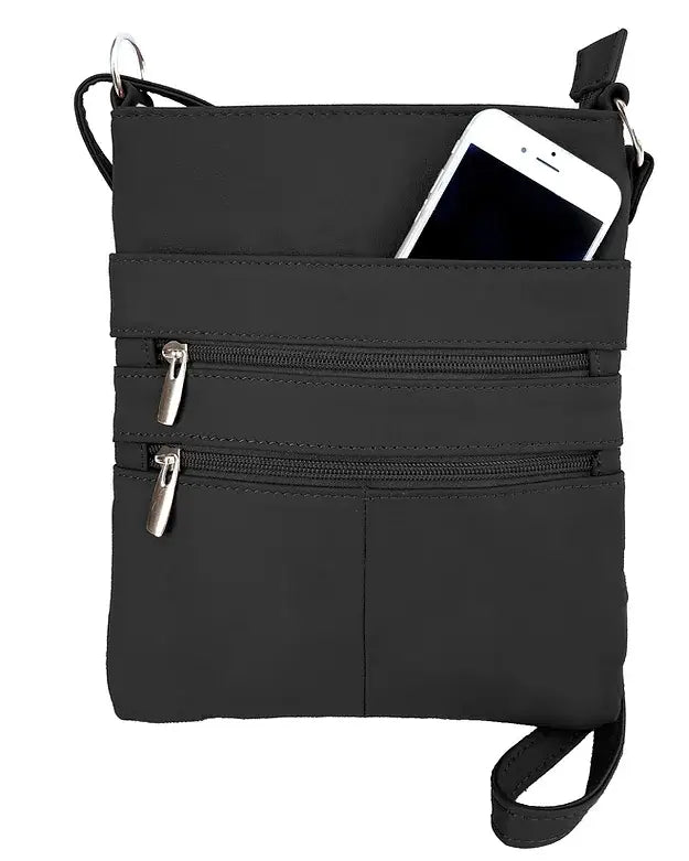 The Large cowhide leather crossbody shoulder bag by Roma Leathers, Inc. is a black cowhide leather bag with two zippered pockets and an open pocket that fits a white smartphone.