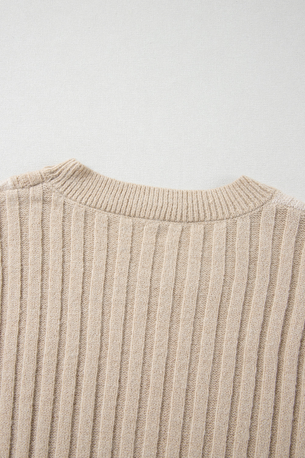 A close-up of the Shewin Khaki Cable Knit Colorblock Crew Neck Drop Shoulder Sweater is showcased against a neutral background.