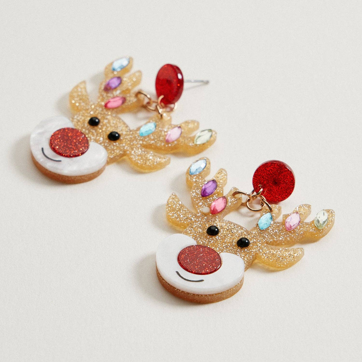 Glitter Rudolph Reindeer Earrings featuring gold glitter, a red nose, and multicolored gemstone lights on the antlers.