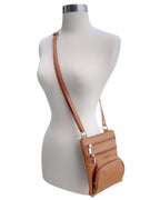 The Roma Leathers, Inc. Cowhide Leather Crossbody with phone pocket features multiple zippered pockets and an adjustable shoulder strap for comfort, shown on a headless, armless mannequin torso.