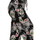 Close-up of a person wearing Leggings Depot Buttery Soft Print Pajama Pants with colorful sugar skulls, floral designs, and an elastic waistband.
