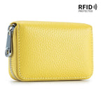 The ACCITY CARD WALLET Anti-Theft Wallet is a yellow textured leather card wallet with a zippered closure and RFID protection shown in the top right corner, blending style with security.
