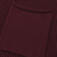 Close-up of the Shewin Patch Pocket Ribbed Knit Short Sleeve Sweater in maroon, showcasing its textured fabric and square pocket, ideal for transitional weather and casual style.