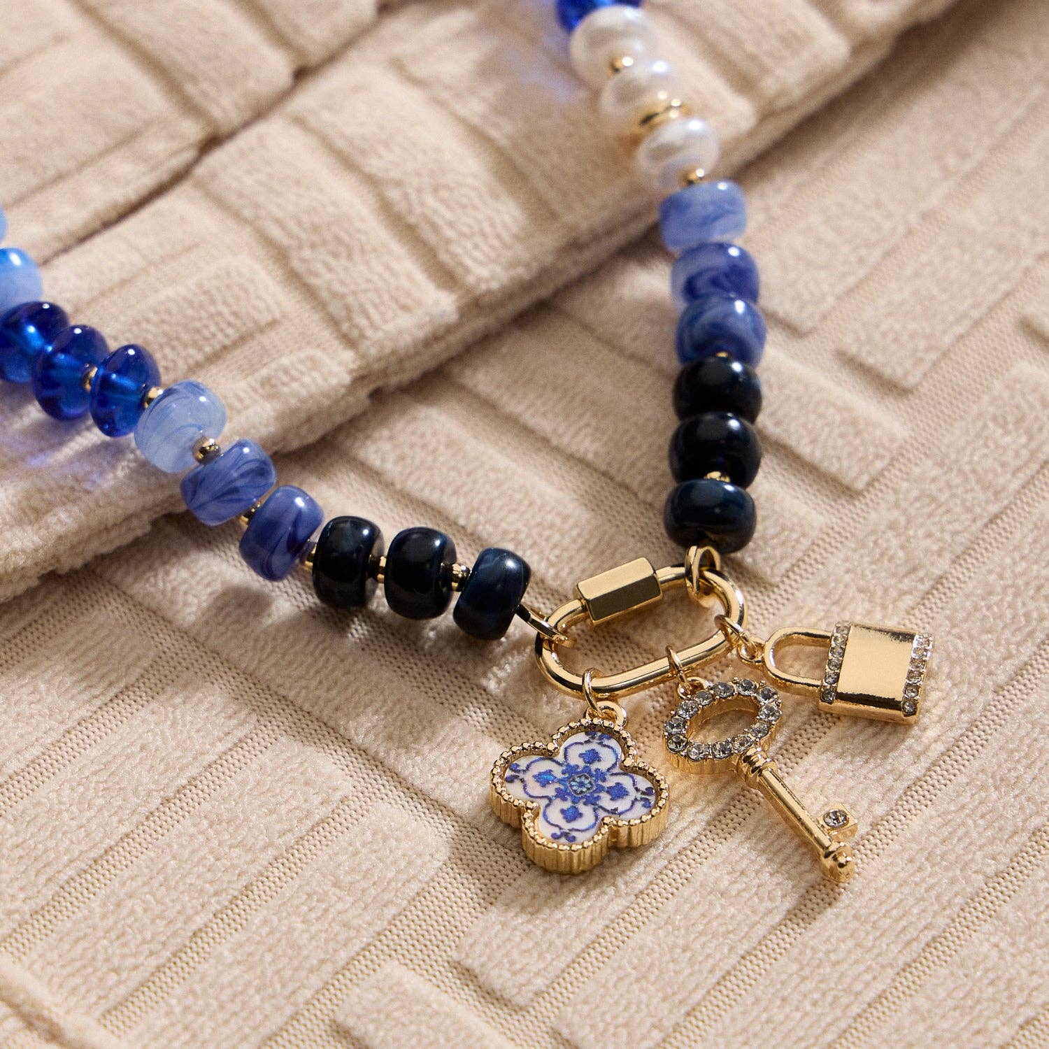 Textured Glass Bead Necklace with Charm Trio Secondary image