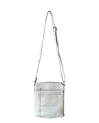 The Roma Leathers, Inc. Cowhide leather crossbody features light gray cowhide leather, an adjustable shoulder strap, a front zippered pocket, and stitched detailing. Photographed on a white background.