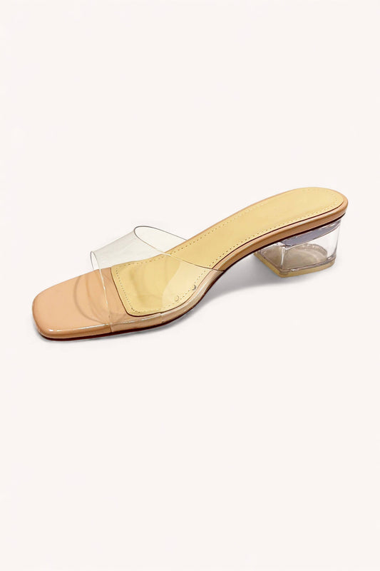 The CCOCCI Clear Slip On Slide Block Heel features a single beige sandal with a transparent block heel and clear toe strap, shown on a white background—an elegant, chic addition to any modern wardrobe.