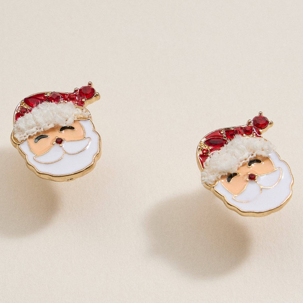 Add festive cheer to your holiday jewelry collection with the Lilla Haven Santa Claus Stud Earrings | Red Rhinestone Christmas Earrings—two charming studs crafted in the shape of jolly Santa faces, complete with red hats and sparkling rhinestones, all set against a plain beige background.