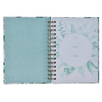 Featuring a white and teal floral cover, the Journal Wirebound Be Still Ps. 46:10 by Christian Art Gifts opens to reveal a "To, From, Date" page on the right and a coordinating patterned page on the left; this Christian Scripture journal beautifully blends inspiration with elegance for your daily reflections.