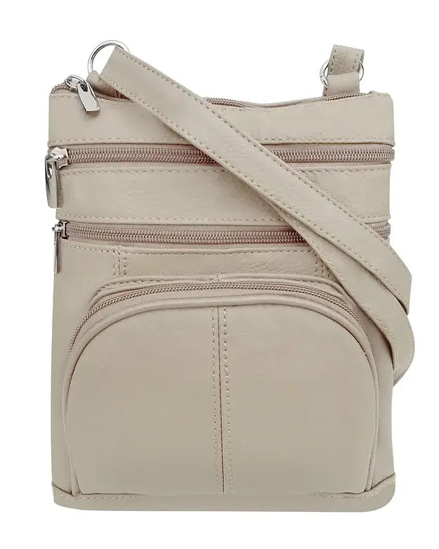 The Roma Leathers, Inc. Cowhide leather Crossbody with phone pocket back side is shown against a white background. This beige bag features an adjustable shoulder strap and multiple zippered compartments for organization.