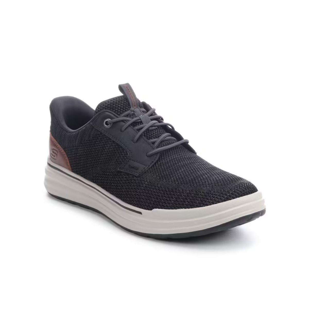SKECHERS Slip-ins Relaxed Fit Sterling - Ramone men’s sneaker in black mesh features a white sole, brown heel accents, and black laces, shown at an angled front-left view. Combining casual comfort with modern style, this SKECHERS design offers a Relaxed Fit for all-day wear.