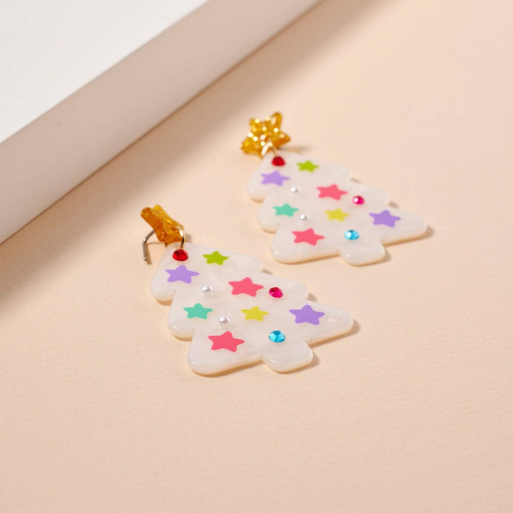 The Glittery Christmas Tree Drop Earrings by Lilla Haven feature vibrant star accents and sparkling rhinestones, making these festive acrylic earrings the perfect statement jewelry for any holiday occasion.