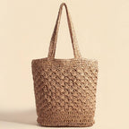 The Anarchy Street Large Woven Straw Fan Stitch Shoulder Tote Bag, featuring two handles, is perfect for summer beach days and is shown upright against a plain beige background.