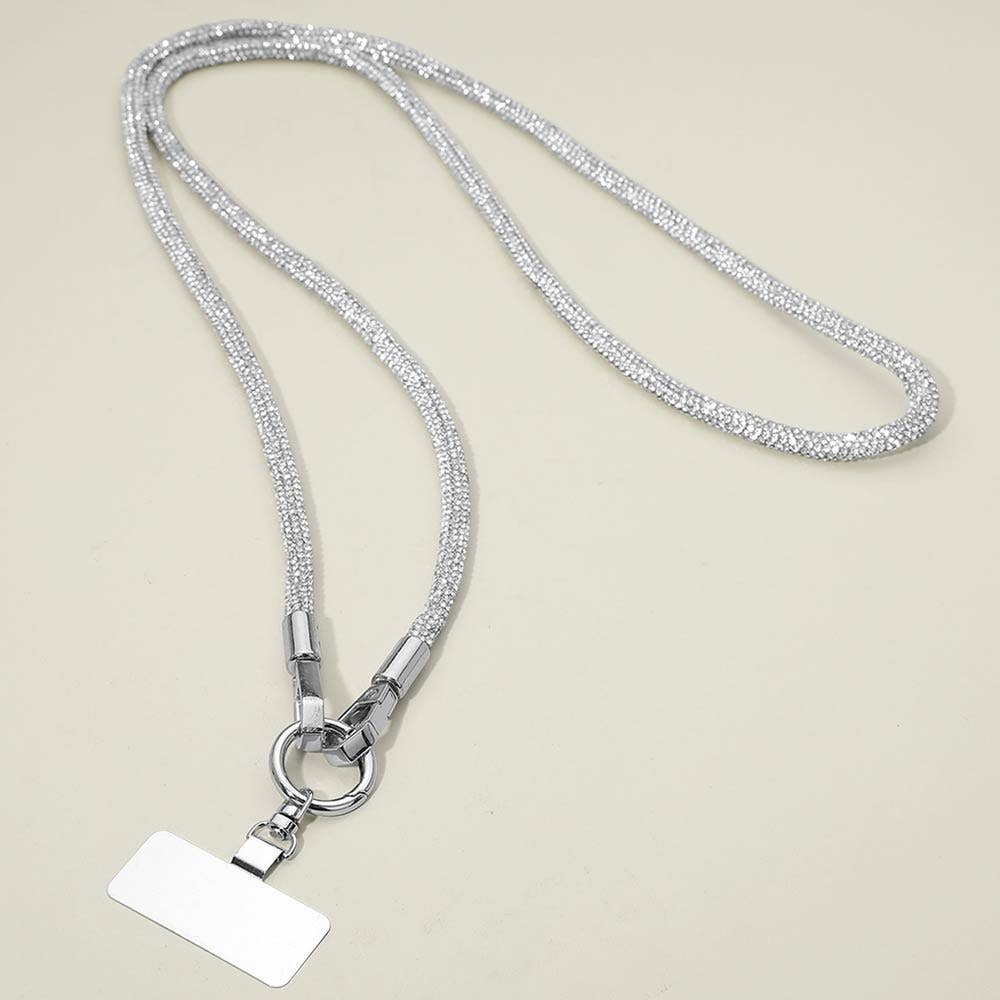 A Rhinestone Phone Lanyard Necklace by Sensibling Corp., featuring a rectangular blank name tag, displayed on a light beige background.