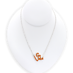 The Tennessee Slogan Necklace by Seasons Jewelry features a sparkling "Go Vols" charm in vibrant orange glitter enamel, displayed on a white jewelry bust against a plain background—the perfect game day accessory for any fan.