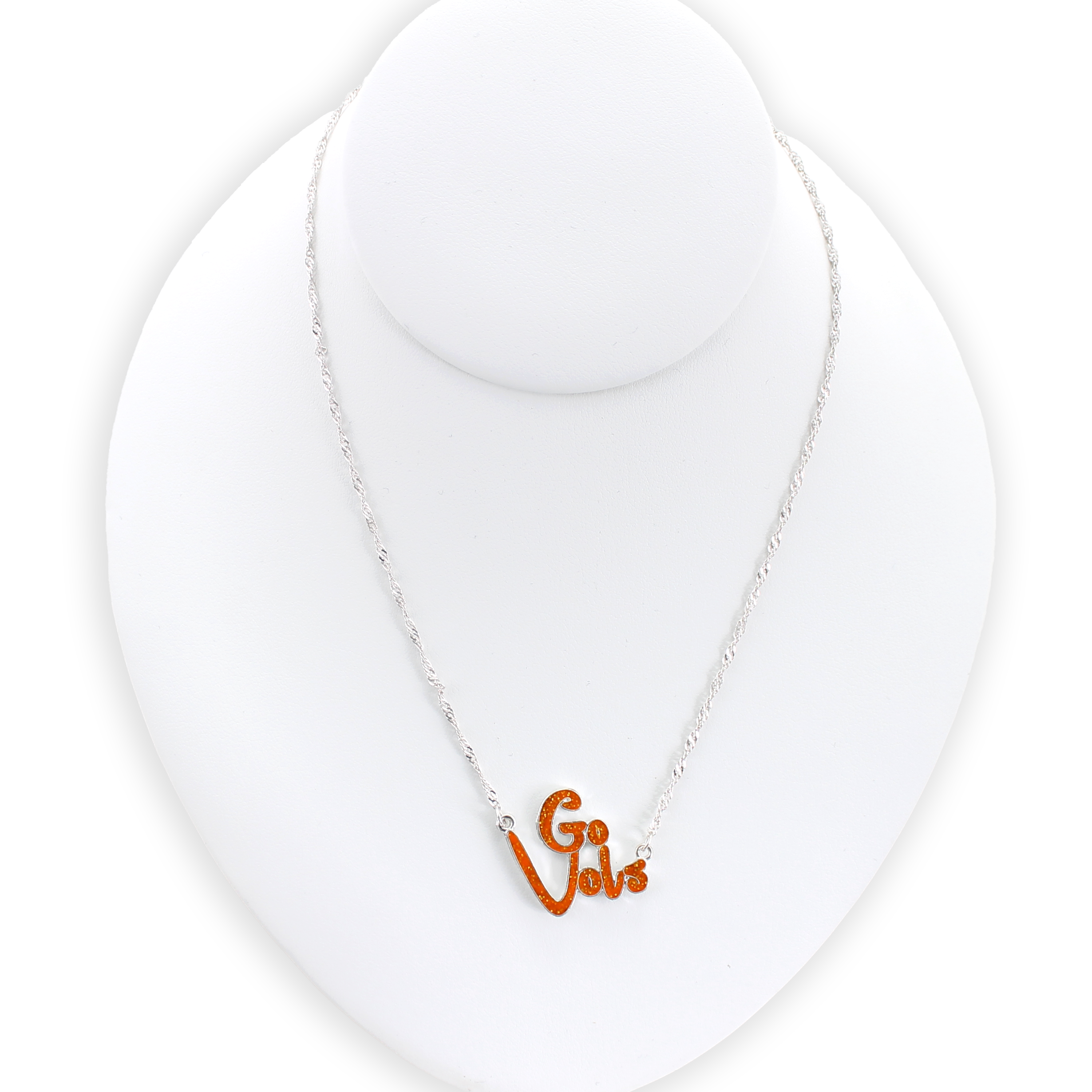 The Tennessee Slogan Necklace by Seasons Jewelry features a sparkling "Go Vols" charm in vibrant orange glitter enamel, displayed on a white jewelry bust against a plain background—the perfect game day accessory for any fan.