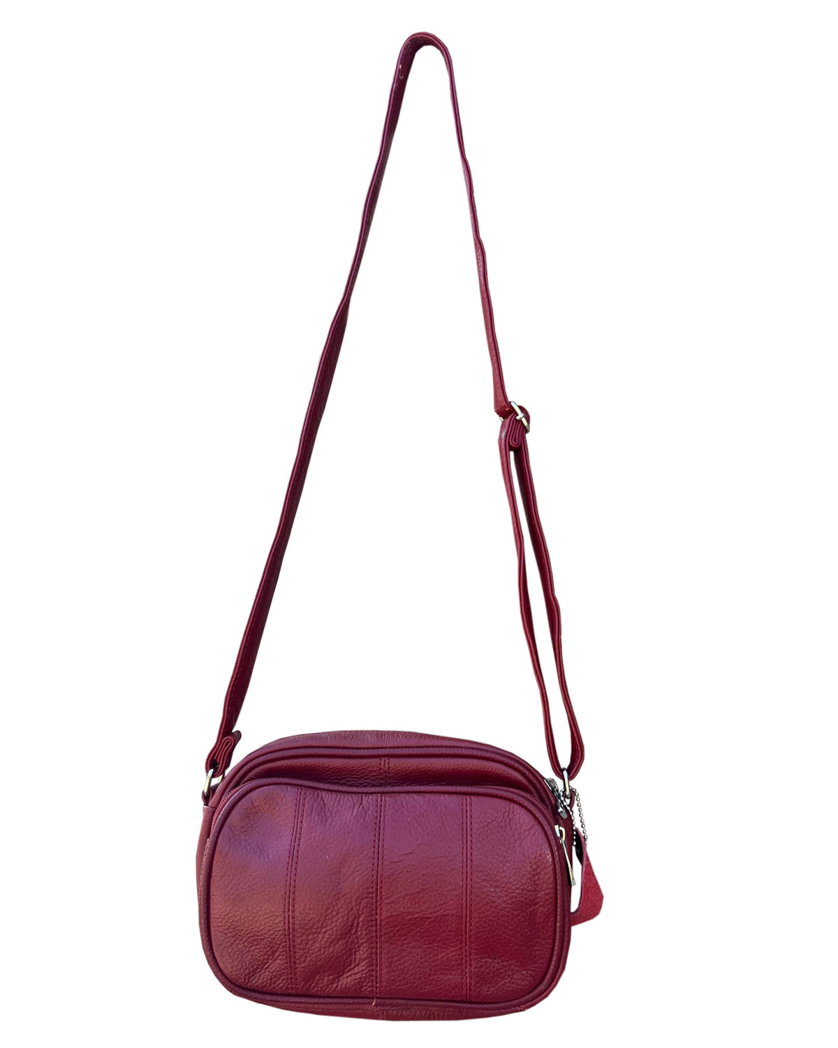 A maroon cowhide leather 3013 Crossbody Bag with front organizer featuring an adjustable shoulder strap and a front pocket.