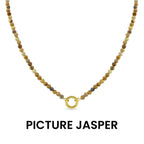 Introducing the WJW Semi Precious Natural Stone Charm Keeper Necklace, crafted with round, earth-toned Picture Jasper beads and highlighted by a central 18K Gold PVD Coated clasp. Presented on a white background, this necklace seamlessly combines the natural elegance of semi precious stones with luxurious gold accents.