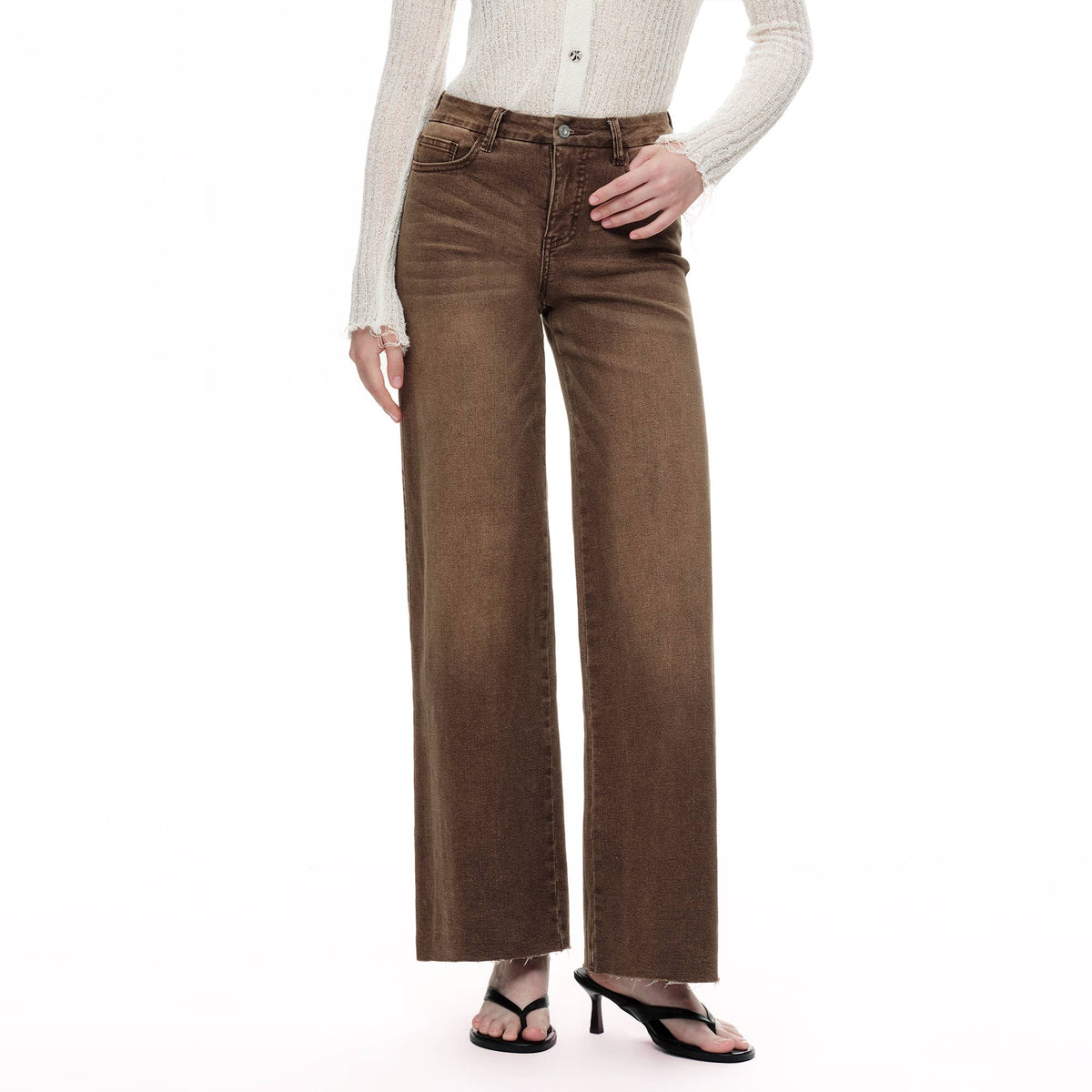 Faire Mid Rise Wide Leg Raw Hem Brown Jeans in a mid-rise, wide-leg brown wash denim with a raw hem. Main image