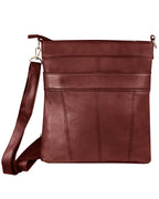 The Roma Leathers, Inc. Cowhide leather crossbody features zip closure, front seams, zippered pockets, and an adjustable shoulder strap, shown here in brown against a white background.