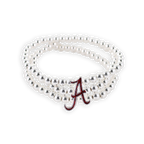 The Alabama Glitter Enamel Logo Stretch Bracelet Set by Seasons Jewelry features three silver beaded stretch strands adorned with a crimson glitter red “A” charm—an ideal addition to any Alabama bracelet collection.