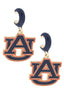 Show your team spirit with the Auburn Tigers Enamel Logo Huggie Hoop Earrings in Navy by Canvas Style, featuring the NCAA officially licensed interlocking “AU” logo in navy blue and orange accented with a bold gold outline. These enamel hoop earrings are the ideal accessory for any devoted fan.