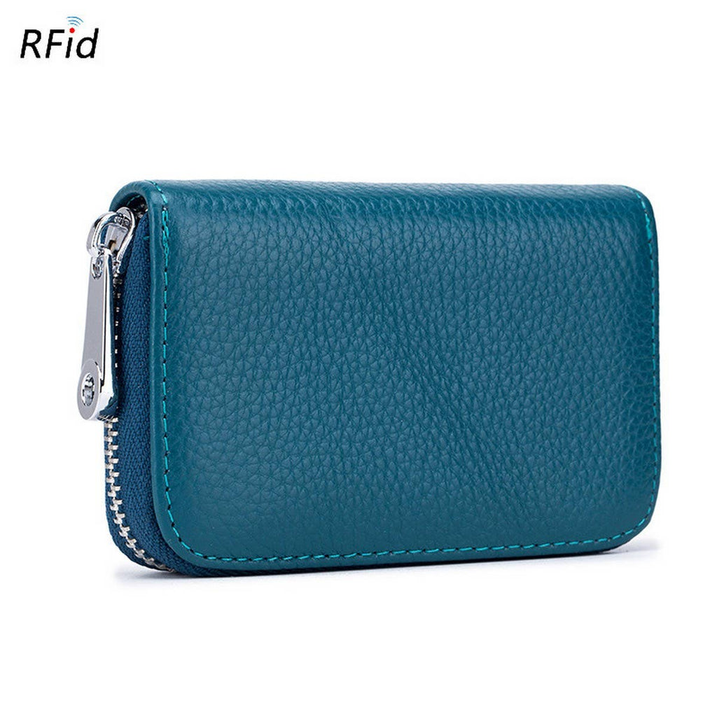 The ACCITY CARD WALLET Anti-Theft Wallet is a teal leather card wallet with a zipper closure, visible stitching, and RFID protection branding in the top left corner for added security.