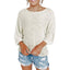 A woman wears the Rosa Clothing Boho Flared Sleeve Loose Knit Sweater paired with distressed denim shorts, standing against a white background.