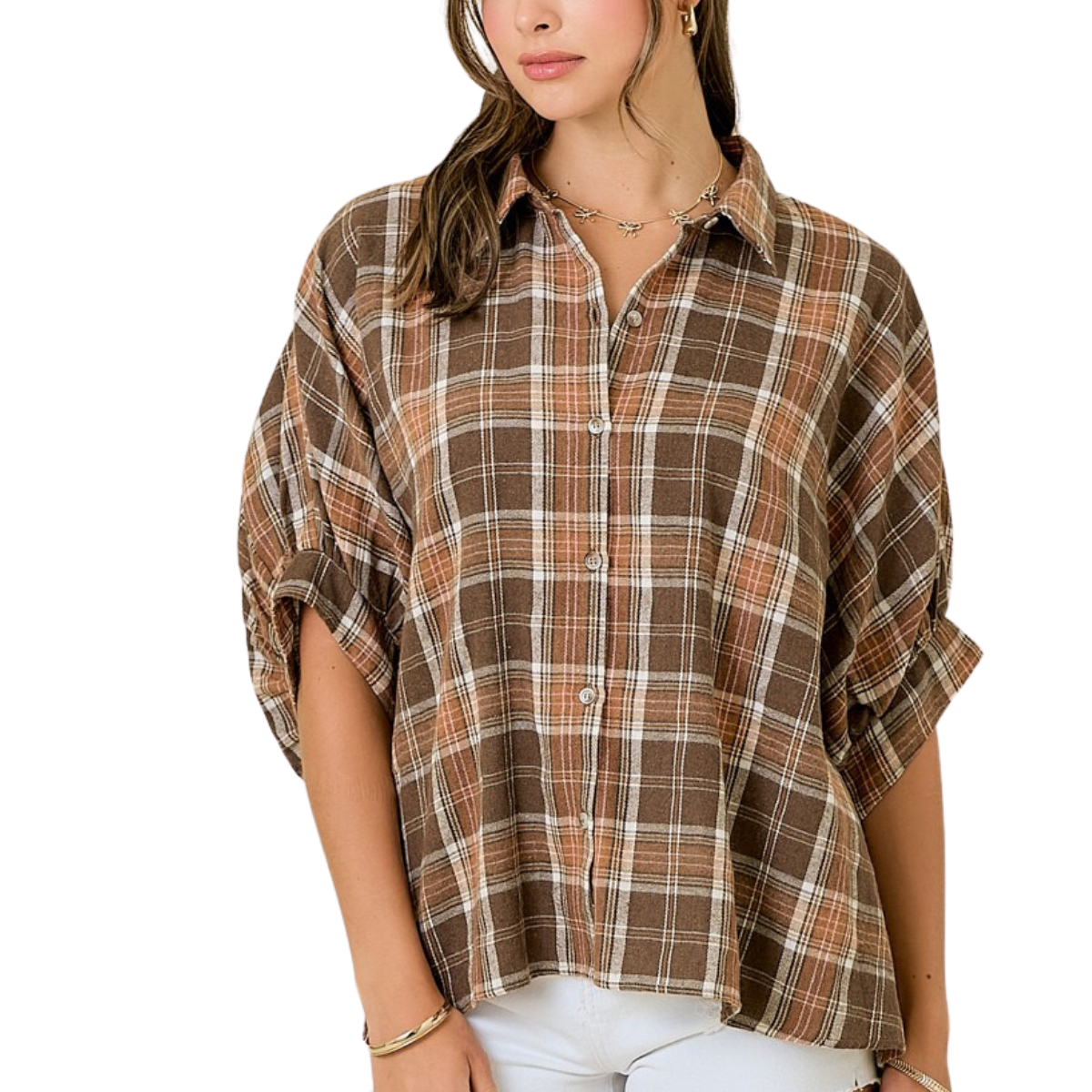 A woman wears the FASHION GO Plaid Oversized Button Down Shirt with rolled sleeves and white pants.