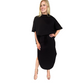 A woman wears the Mock Neck Terry Skirt Set by Carol Christian, featuring a black mock neck top and matching skirt with a side slit, paired with nude heeled sandals.