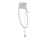 A designer-inspired SPECIAL EFFECTS 2 Row Beads and Pearl Necklace and Earrings Set, featuring a silver layered necklace with a clear teardrop pendant, is displayed on a white "été" card, perfectly complementing pearl stud earrings for an elegant look.