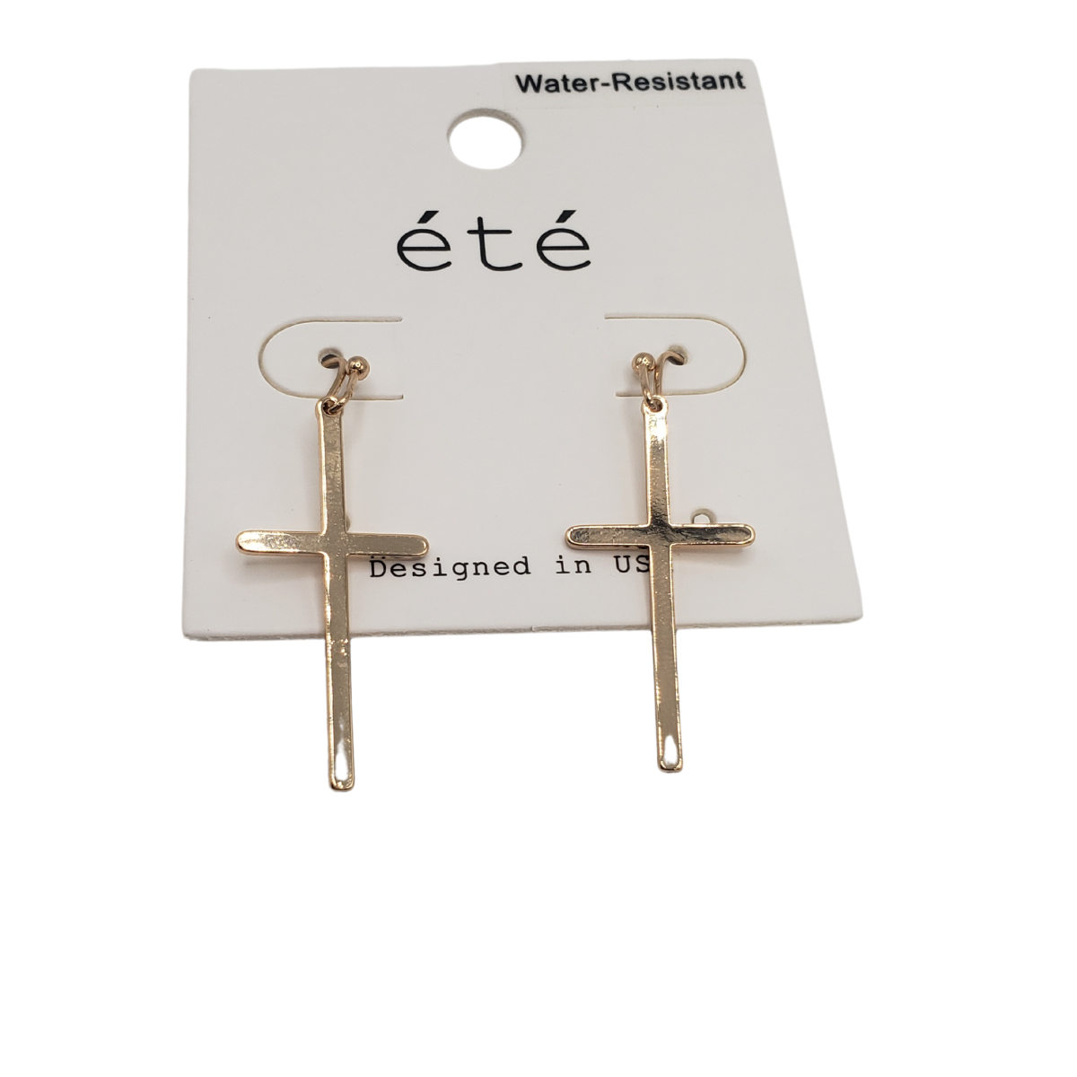 Gold-tone cross dangle earrings on a white card labeled "SPECIAL EFFECTS" with "Water-Resistant" above and "Designed in US" below.