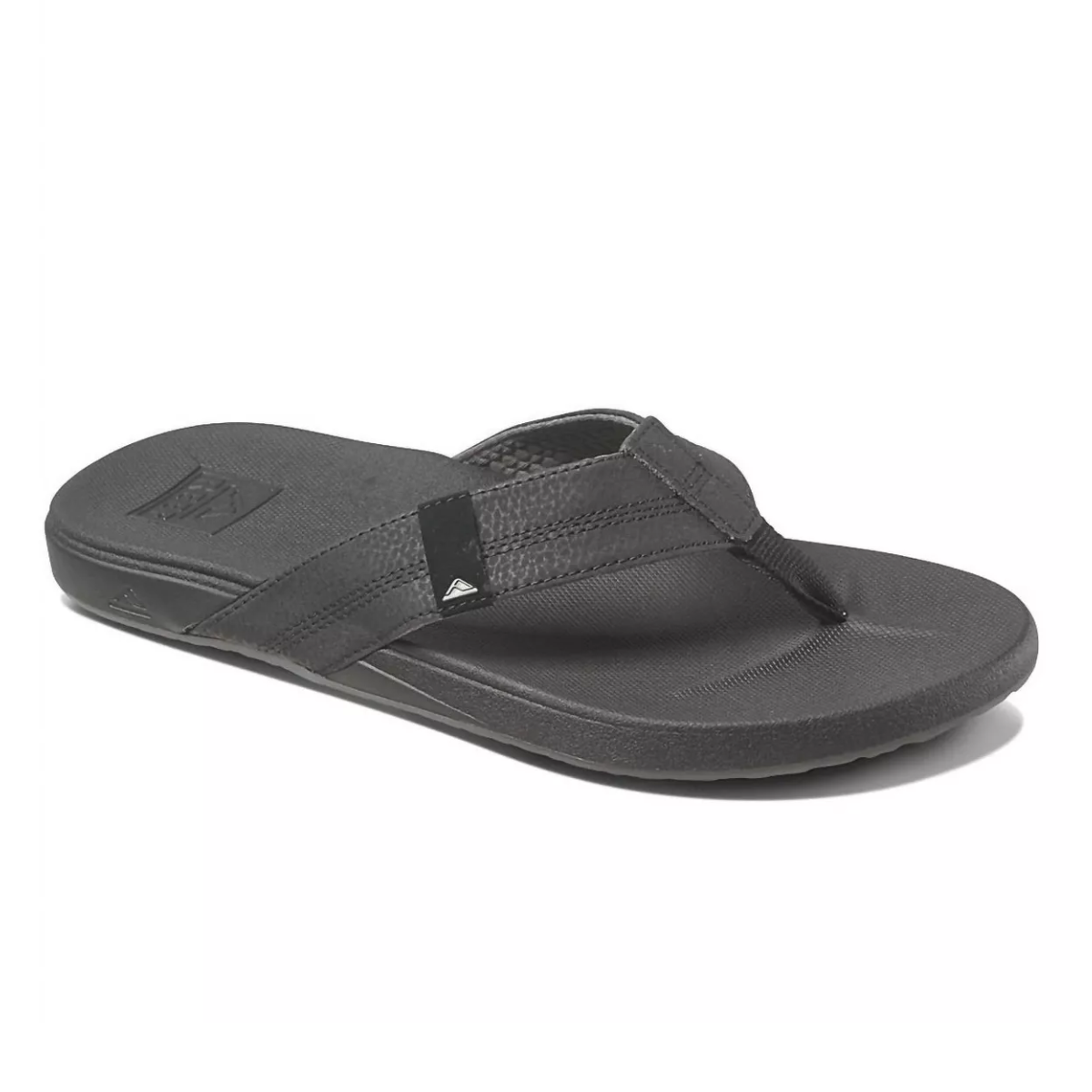 The REEF Cushion Phantom Men's flip flop in Black features a cushion rebound footbed and anatomical arch support, along with a wide strap and high-density rubber outsole.
