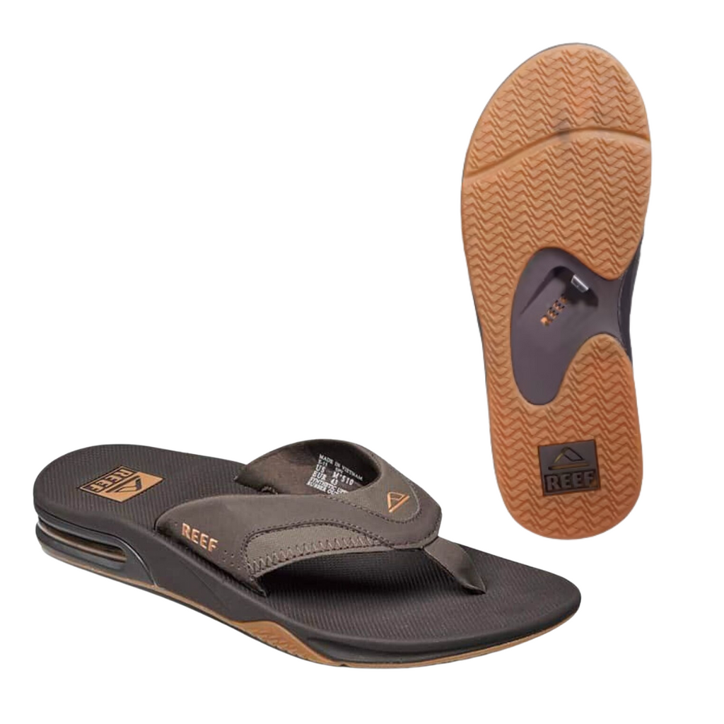 The Reef Fanning Men's Flip Flop in Brown Gum by REEF is perfect for beach adventures, featuring anatomical arch support, a textured sole, and the brand's logo on both the strap and the sole.