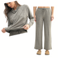A woman wears the FASHION GO Brushed Hacci Lounge Set in grey, featuring a relaxed-fit long-sleeve top and matching pants in soft fabric, styled with tan slippers for a cozy look.